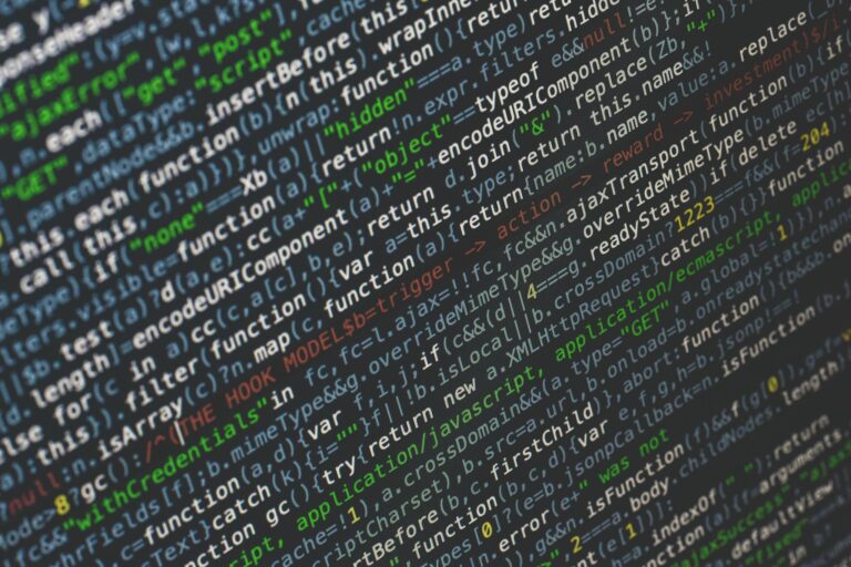 Close-up of colorful programming code displayed on a computer screen.